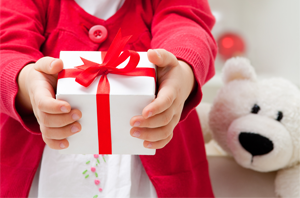 A child holding a gift box